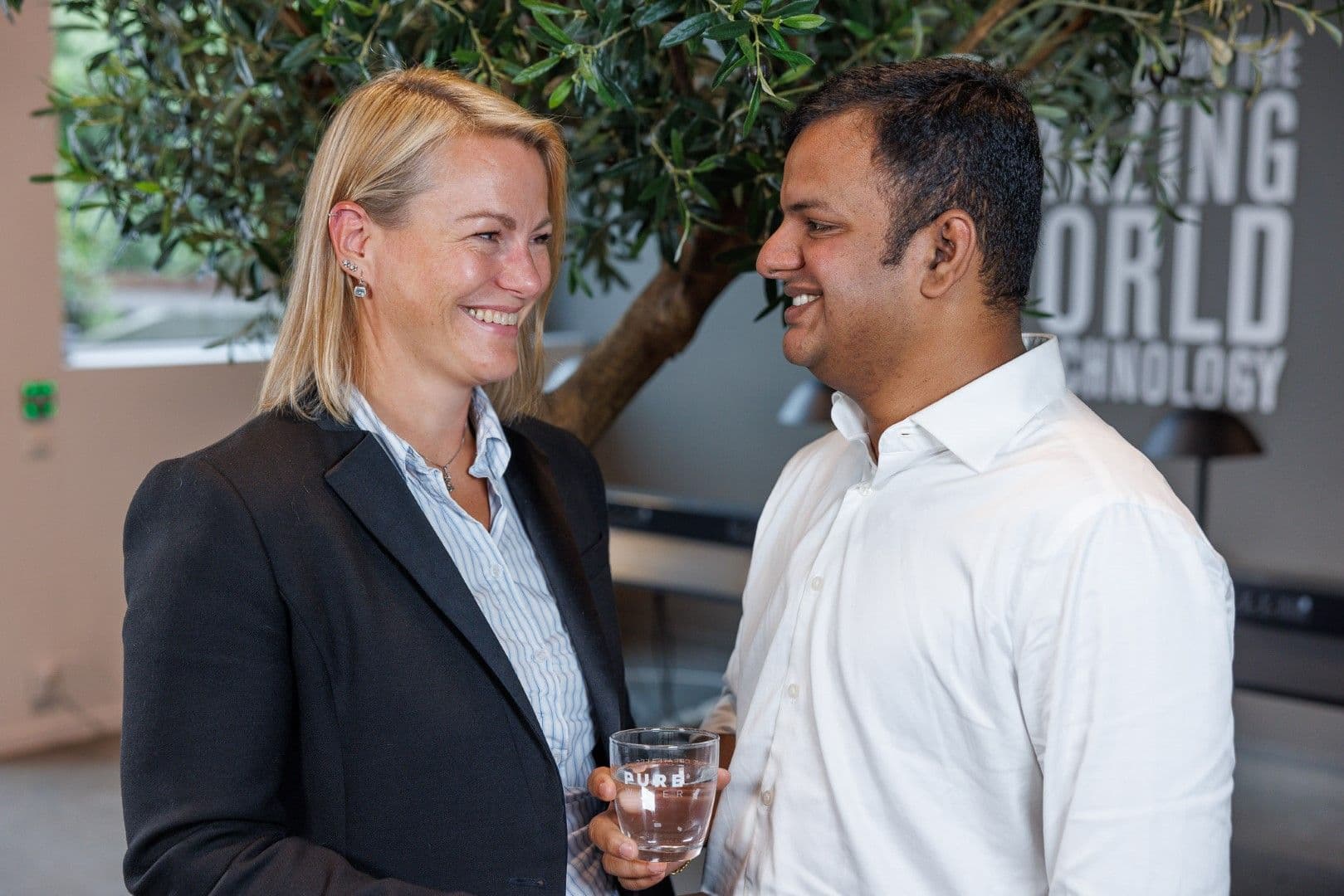 Smiling woman and man looking at each other.